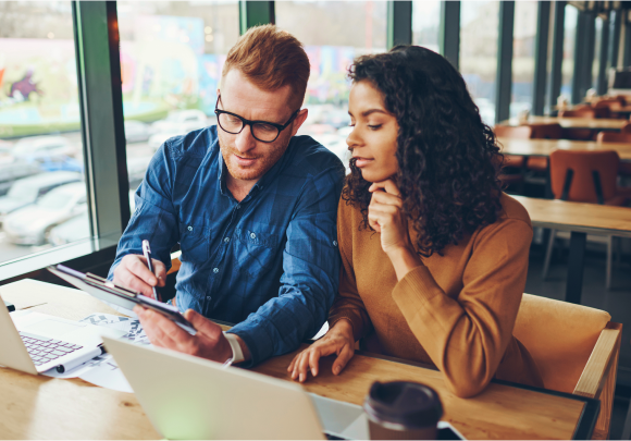 two people coworking at a coffee shop