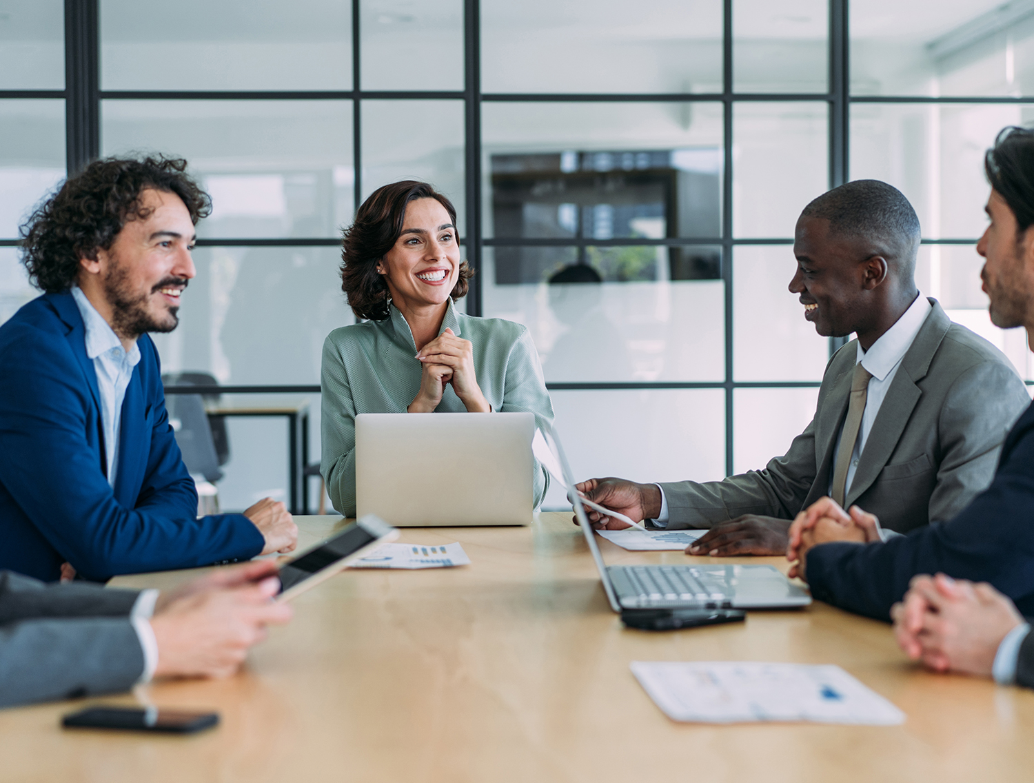 Group of business persons in business meeting. Group of entrepreneurs on meeting in board room. Corporate business team on meeting in the office.