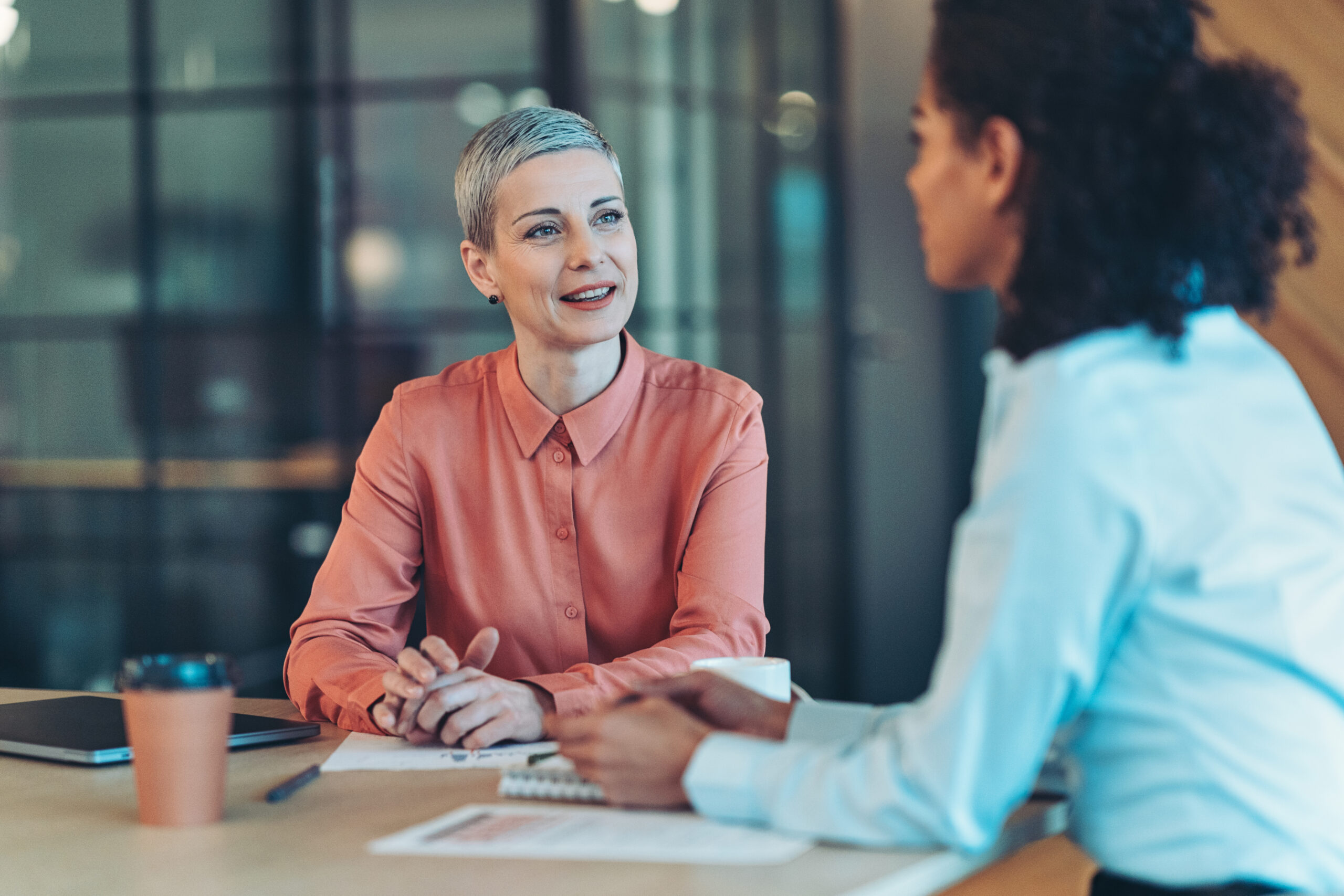 Two businesswomen talking in the office